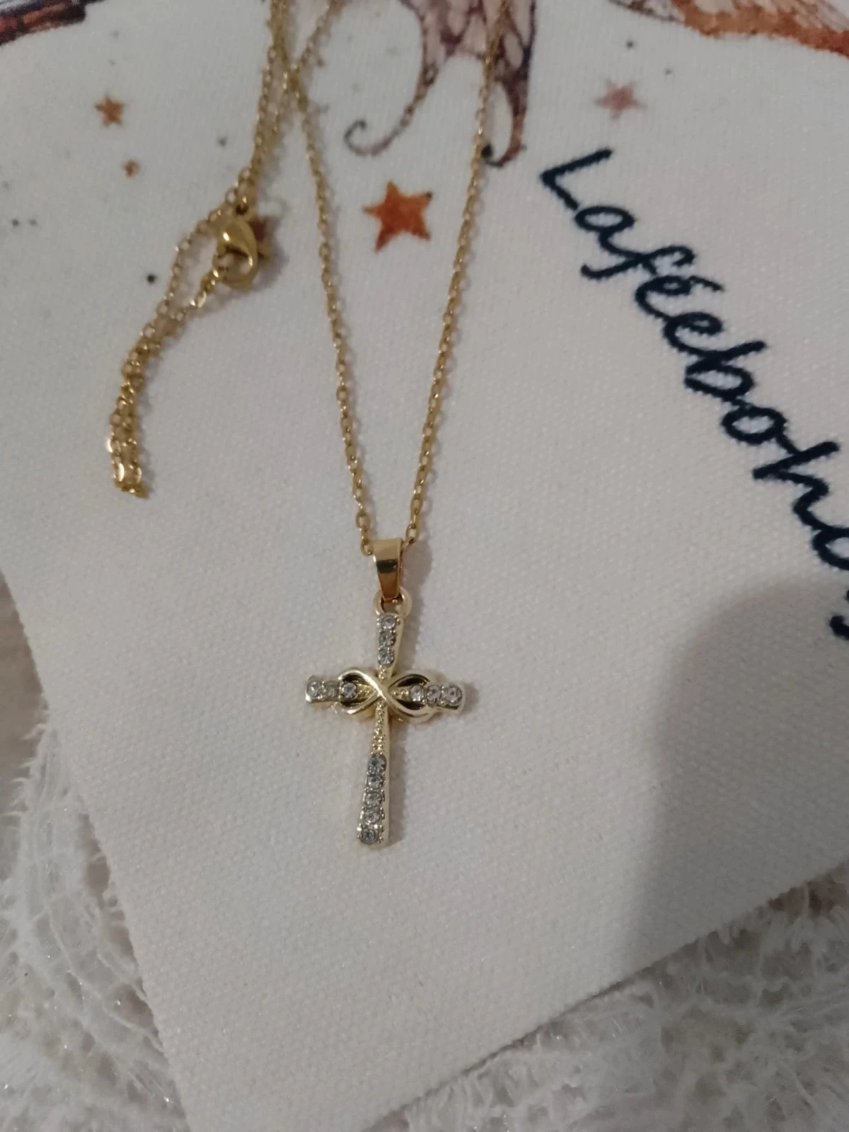 Collier croix en acier inoxydable doré avec zircons